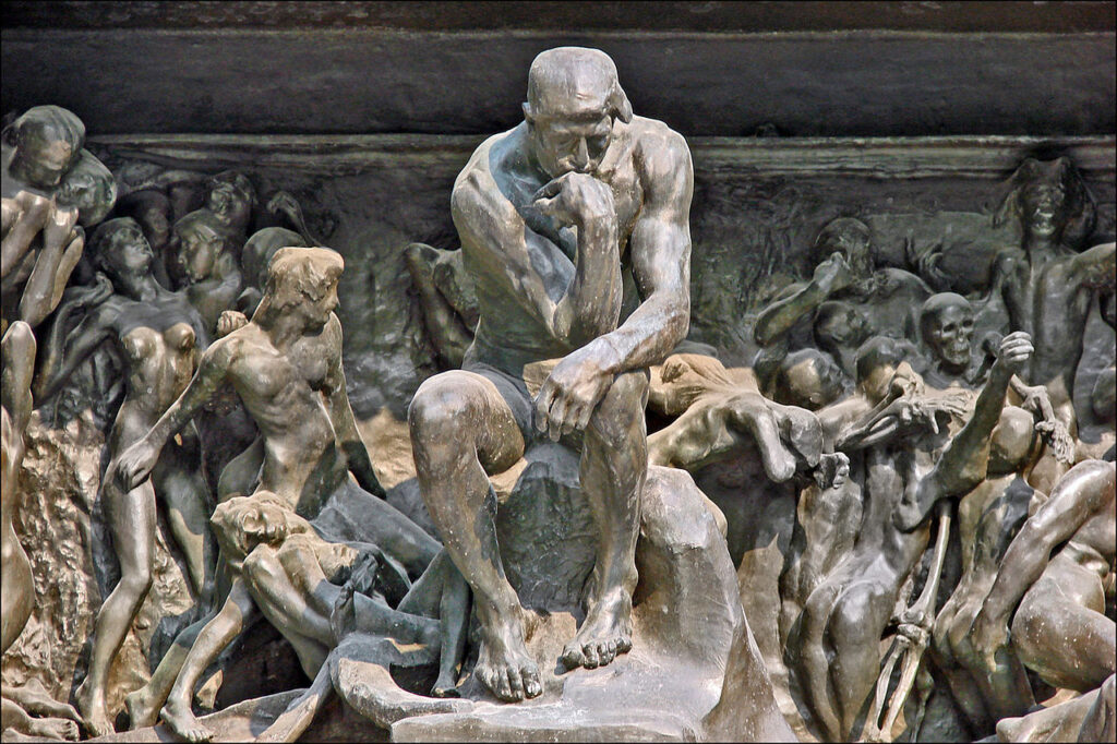 Rodin's Thinking Man at the Gates of Hell - The powerful, muscular figure was intended to represent Dante himself, contemplating the suffering and sins depicted in hell, but it also evolved into a universal symbol of the creative mind and human thought. 